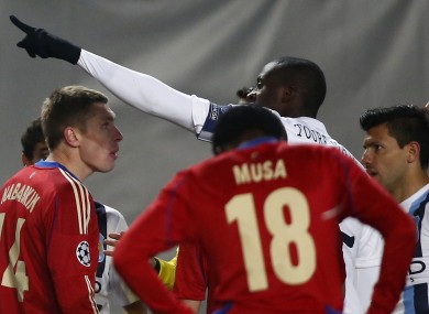Yaya Toure, centre, pointing towards fans speaks to the referee Ovidiu Hategan, unseen, CSKA's Kirill Nababkin, left, and Musa, back to camera, during the Champions League group D match between CSKA Moscow and Manchester City.