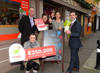 National Lottery Sales Representative Martin Manley congratulates staff at Counihan’s Shop, Princes Street, Tralee on the sale of a the prize winning ticket.