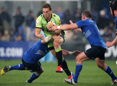 Leinster's Shane Jennings and Aaron Dundon tackle George North of Northampton Saints.