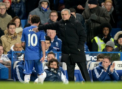 Chelsea manager Jose Mourinho with a pat on the back for Juan Mata after he is substituted.