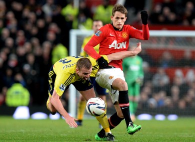 Manchester United's Adnan Januzaj (right) battles for the ball with Sunderland's Lee Cattermole.