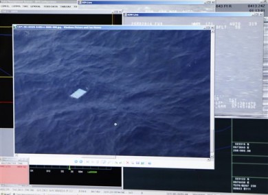 Computer monitor onboard shows an object floating in an area within the search zone.