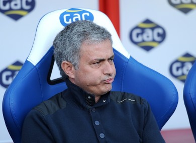 Mourinho watches on during his side's game today.