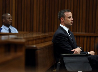 Oscar Pistorius, listens to ballistic evidence being given in court in Pretoria.