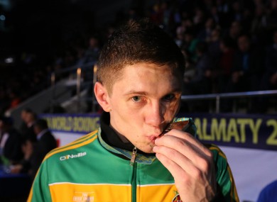 Quigley kisses his silver medal at last year's world championships.