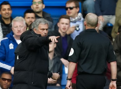 Jose Mourinho exchanges comments with referee Mike Dean.