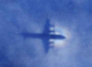 Shadow of a New Zealand Air Force plane searching the Indian Ocean.
