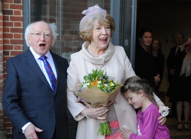 Martha Wainwright 6, presents flowers to Irish President Michael D. Higgins and his wife Sabina Higgins