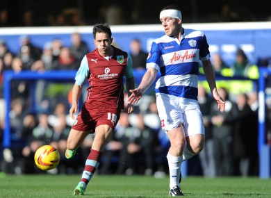 Richard Dunne and Burnley's Danny Ings compete for possession.