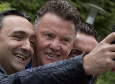 A Netherlands fans takes a picture with national boss Van Gaal this weekend.