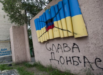 A concrete depiction of the yellow-blue Ukrainian flag painted over with the flag of the Donetsk republic in Artemovsk, eastern Ukraine.