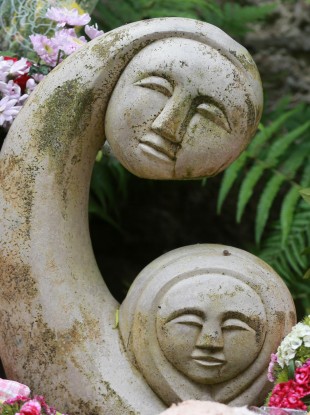 Childrens teddy's and toys along with flowers sit at the 'Little Angels' memorial plot in the grounds of Bessborough House in Blackrock, Cork.