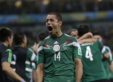 Mexico's Javier Hernandez celebrates after his team scored its first goal against Croatia.