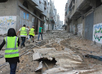 Moments before he is shot dead, Salem Khaleel Shamaly (in green t-shirt) leads a group to find his family in Gaza city.