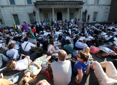 Hundreds of protesters lie down in front of the Department of Foreign Affairs in Dublin last week.