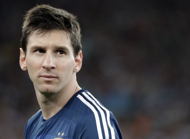 Argentina's Lionel Messi looks back as he goes up to get his runner-up medal.