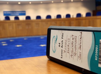 A file lays on a desk at the European Court of Human Rights ahead of an hearing on the Yukos versus Russia case.