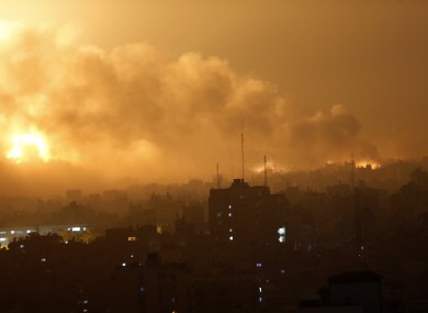 Smoke rises as flames spread across buildings after Israeli strikes in the Shijaiyah neighborhood in Gaza City.