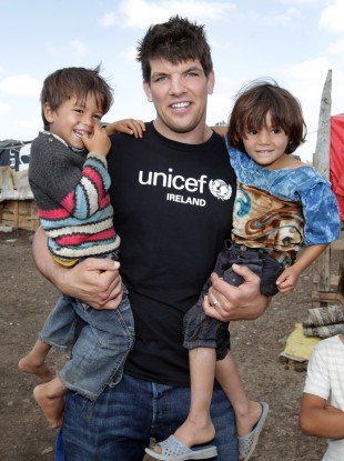 Munster rugby player Donncha O' Callaghan with Syrian refugees in Lebanon.
