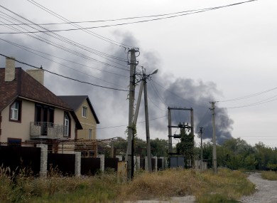 Smoke rises over a residential area in the north of the rebel-held city of Donetsk earlier today.