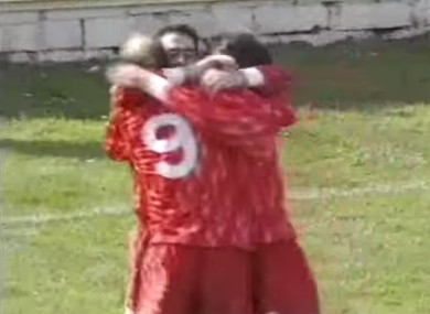 McNulty is hugged by team-mates after scoring.