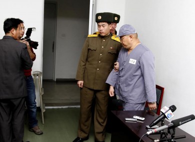 File pic: American missionary Kenneth Bae, right, leaves after speaking to reporters at Pyongyang Friendship Hospital in Pyongyang (January).