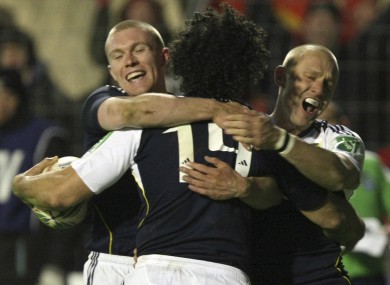 Doug Howlett, centre, celebrates Munster's fourth try against Perpignan in 2009 with Keith Earls and Paul Warwick.
