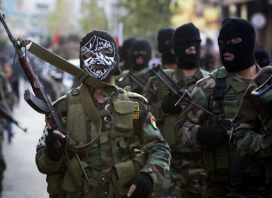 Palestinian security forces march to mark the 50th anniversary of the Fatah movement in the West Bank city of Ramallah today.