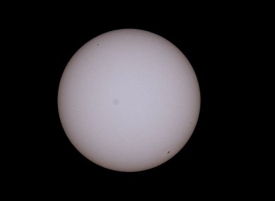 A solar eclipse as viewed through a solar filter.