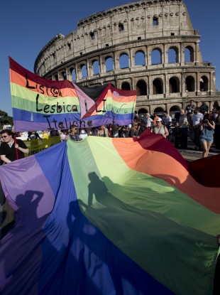 Rome's Gay Pride march passes the Colosseum.