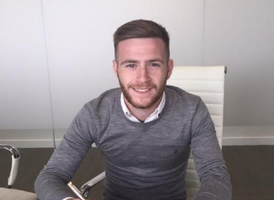Byrne pictured signing his new contract.