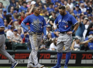 Ezequiel Carrera, left, and Kevin Pillar have no idea what has just happened.