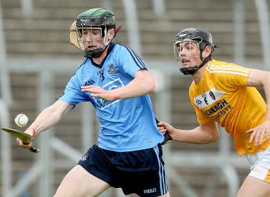 Dublin’s Ciaran Dowling chased by Gerard Walsh of Antrim.