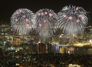 Macy's Fourth of July fireworks light up the sky over the East River in New York in a view from One World Observatory.