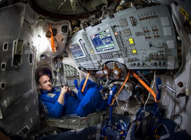 Astronaut Scott Kelly sits inside a Soyuz simulator at the Gagarin Cosmonaut Training Center