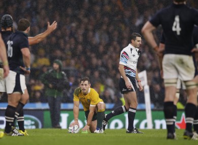 Australia's Bernard Foley prepares to kick the match-winning penalty beside referee Craig Joubert.