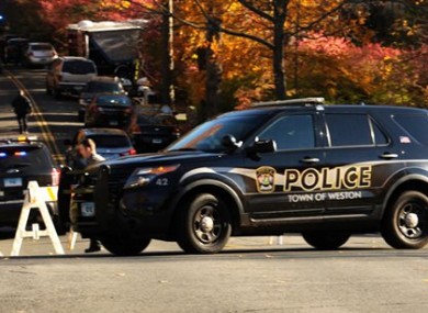 State Police search the area around a home in Weston reportedly belonging to a friend of Kyle Navin.