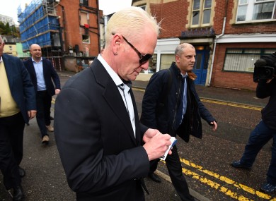 Paul Gascoigne signs an autograph as he arrives back at Bournemouth Magistrates court with solicitor Gavin Harris (right) after the lunch break where pleaded guilty to harassment of his former girlfriend and assaulting a photographer.