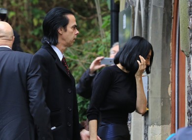 Musician Nick Cave with his wife Susie Bick arrive at the Coroners Court in Brighton