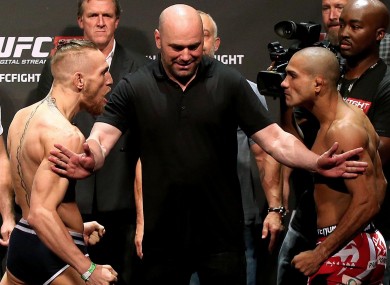 UFC president Dana White separates Conor McGregor and Diego Brandao at the weigh-ins ahead of their fight last year.