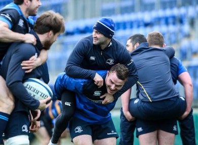 Peter Dooley gives Dave Kearney a bit of a lift.
