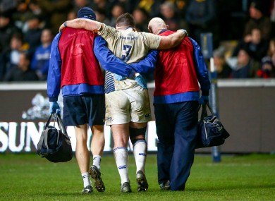 Marty Moore is helped off the field at the weekend.