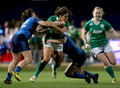 Ireland's Sene Naoupu tackled by France pair Elodie Poublan and Lucile Godiveau.