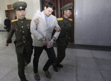 Otto Warmbier is escorted at the Supreme Court in Pyongyang.