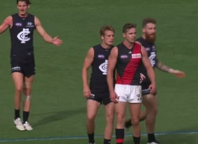 Byrne and Tuohy in action for Carlton.
