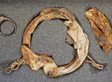 A necklace and ring retrieved from an old mug at Auschwitz