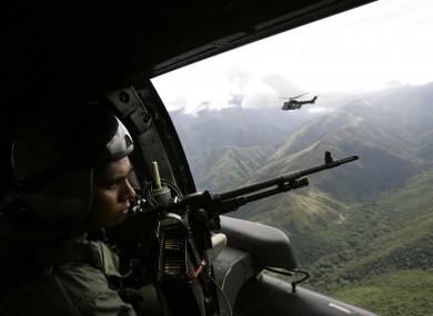 Venezuelan army helicopters fly over the Sierra de Perija national park, west of Venezuelan capital Caracas, where poppy and marijuana plants are often discovered
