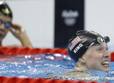 Yulia Efimova, left, looks on as Lilly King celebrates victory in the 200m breaststroke.
