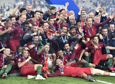 Portugal players celebrate after winning the Euro 2016 final.