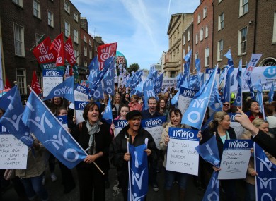 Nurses take part in a pay restoration protest at Leinster House last month.